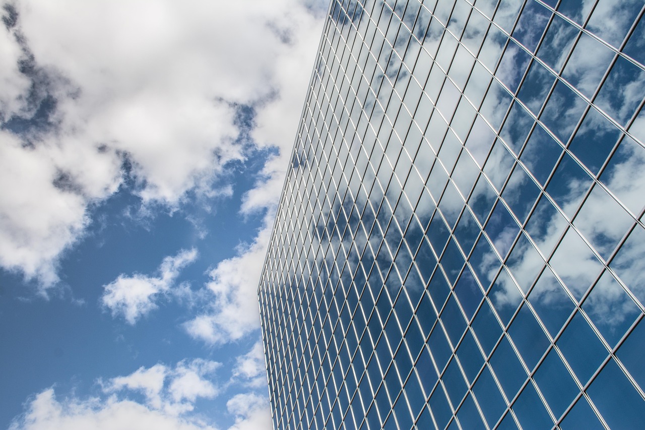 Building, reflection, clouds — Enhance Your Vehicle's Safety with High-Performance Car Alarms - NZDesi's Exclusive Collection